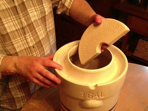 ohio stoneware ceramic weights going into the pickling crock 